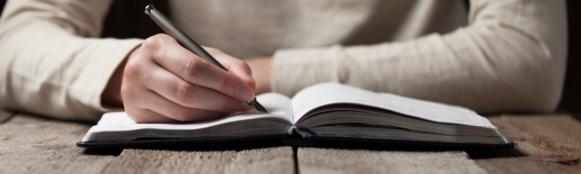 Hand writing in a notebook