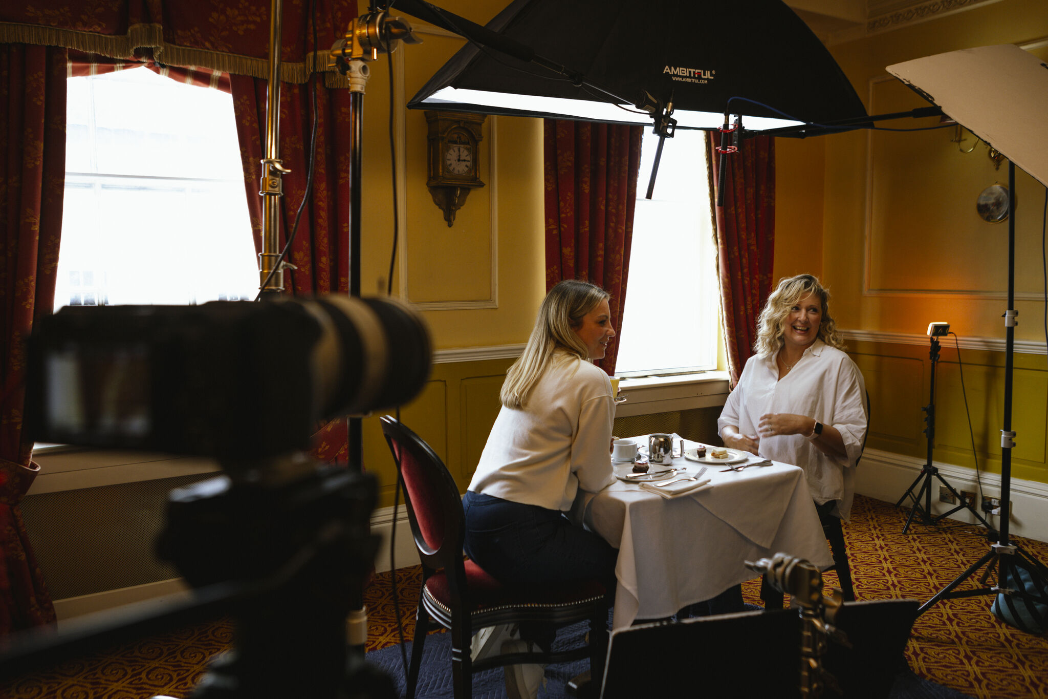 Two women sitting at a table during an interview