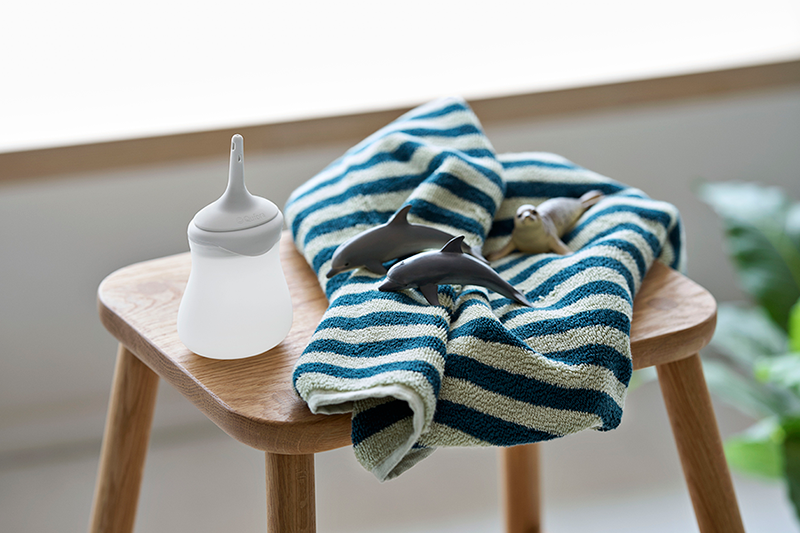 Qufora Irrisedo MiniGo in a bathroom setting with kids bath toys