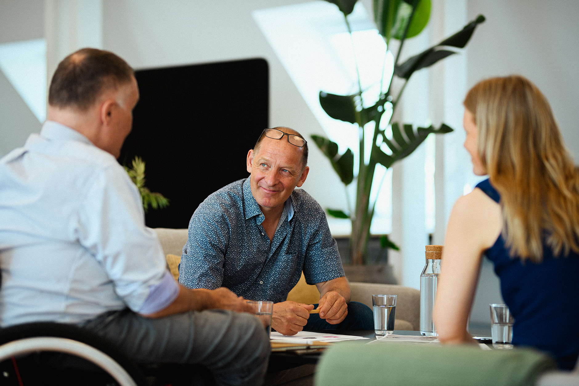 Three Qufora employees in cinversation