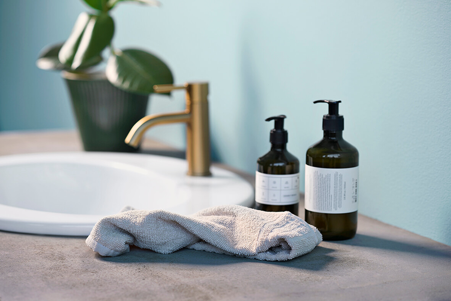 Qufora image showing a bathroom setting with soaps by the sink