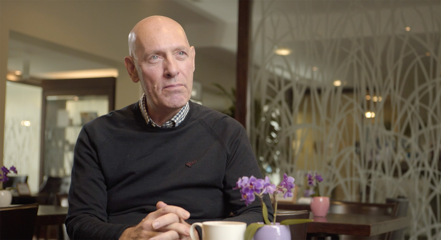 Man sitting at table in an interview