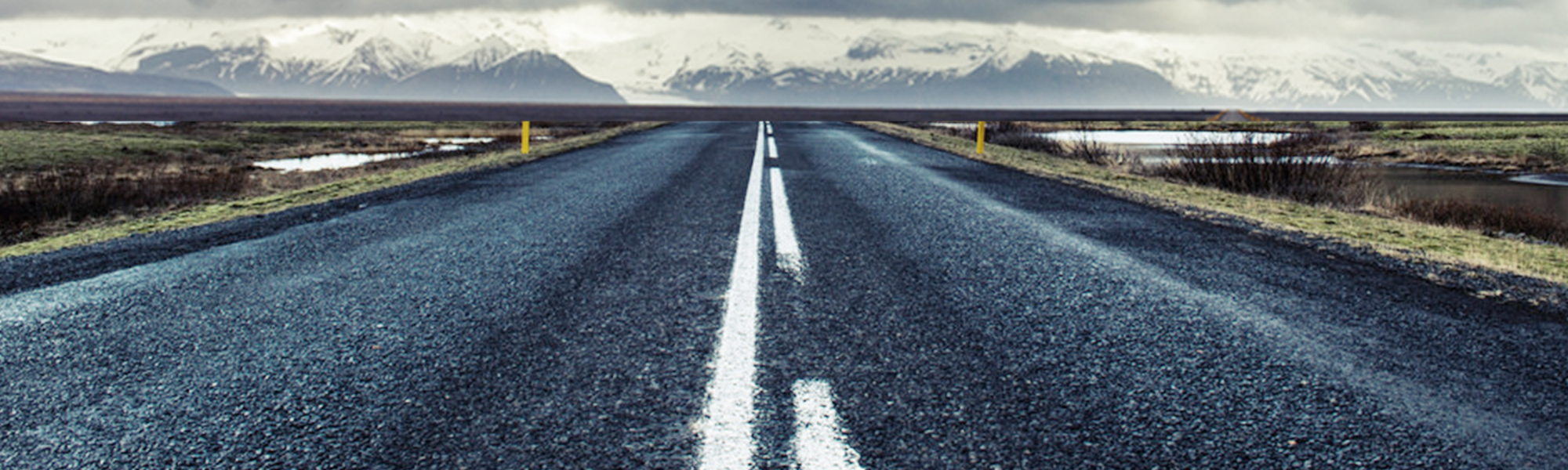 Landscape with a road, fields and mountains