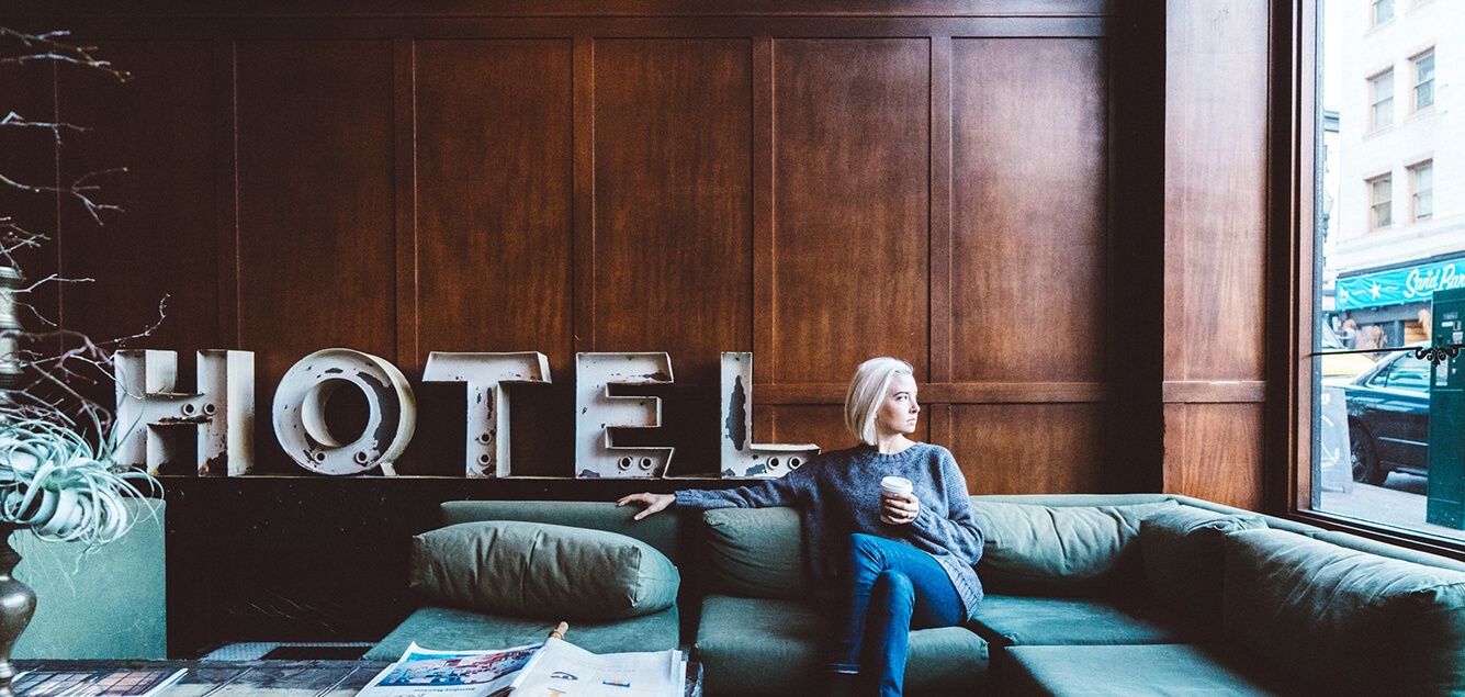 Woman sitting in hotel lobby