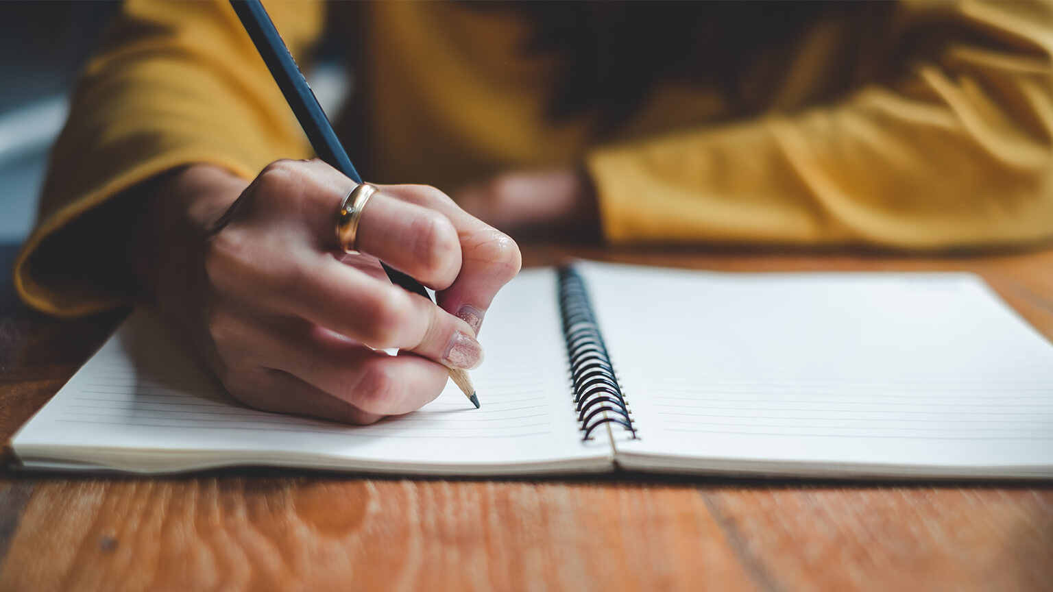 Woman writing in journal
