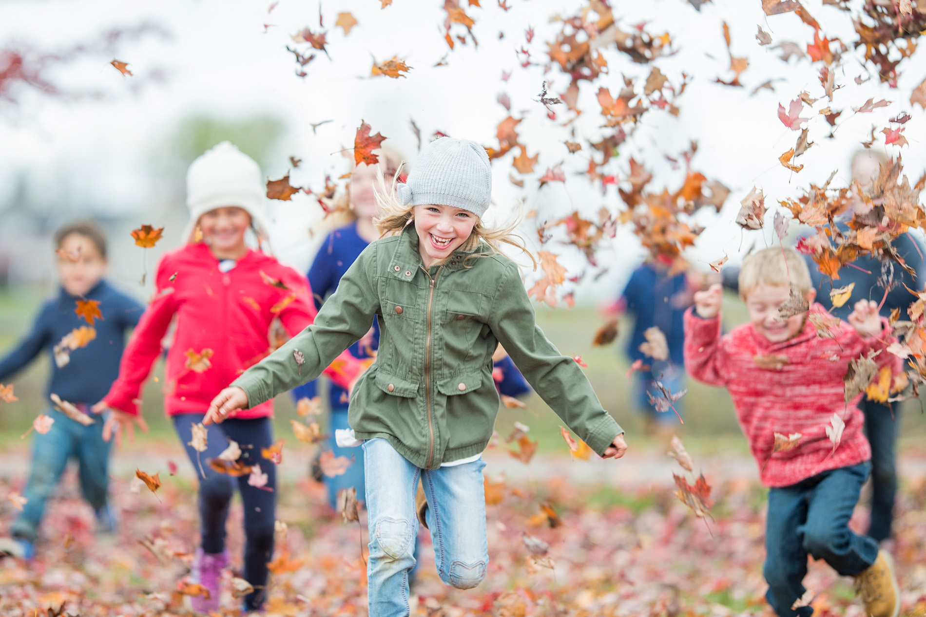 Children playing outside in autumn