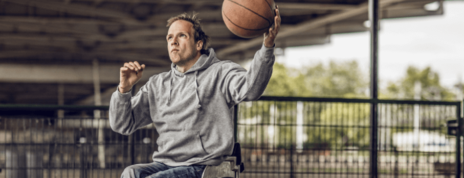 Man in wheelchair playing basket