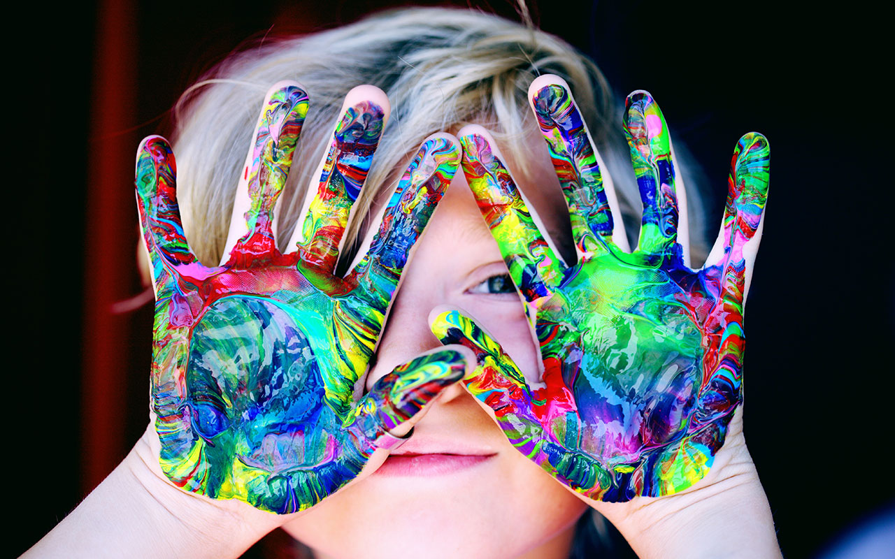 Child with paint on his hands